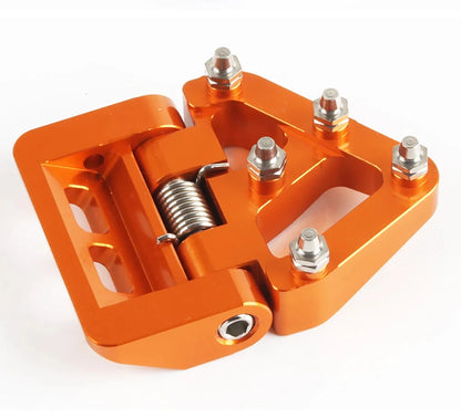 Pedal de freno trasero plegable